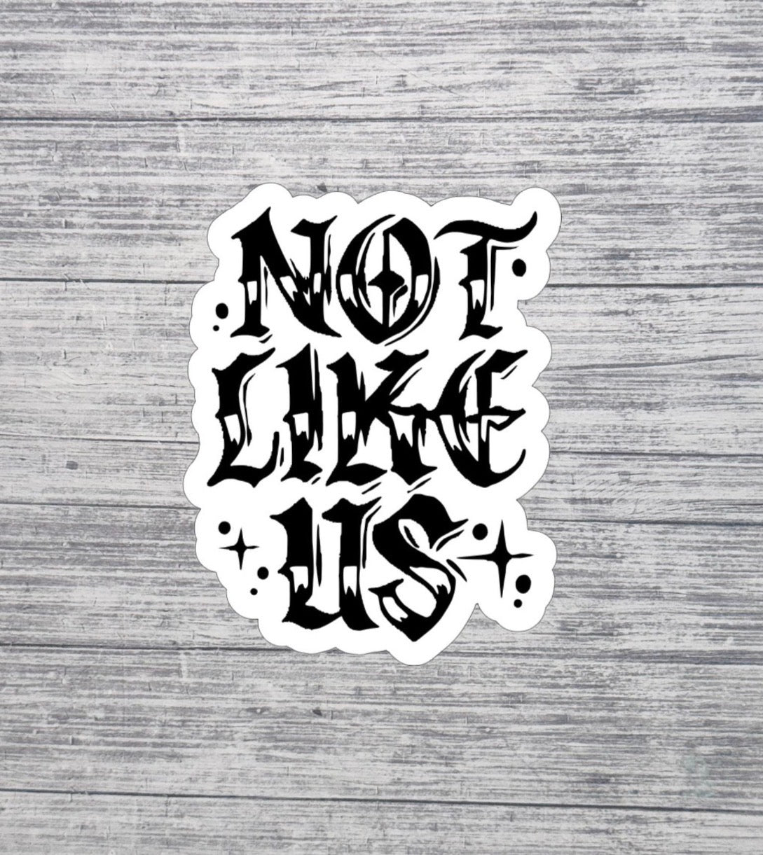 Not Like Us Gothic Lettering Sticker
